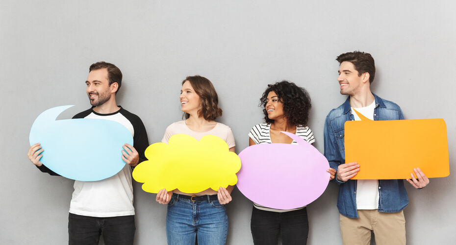 Four people holding speech bubbles